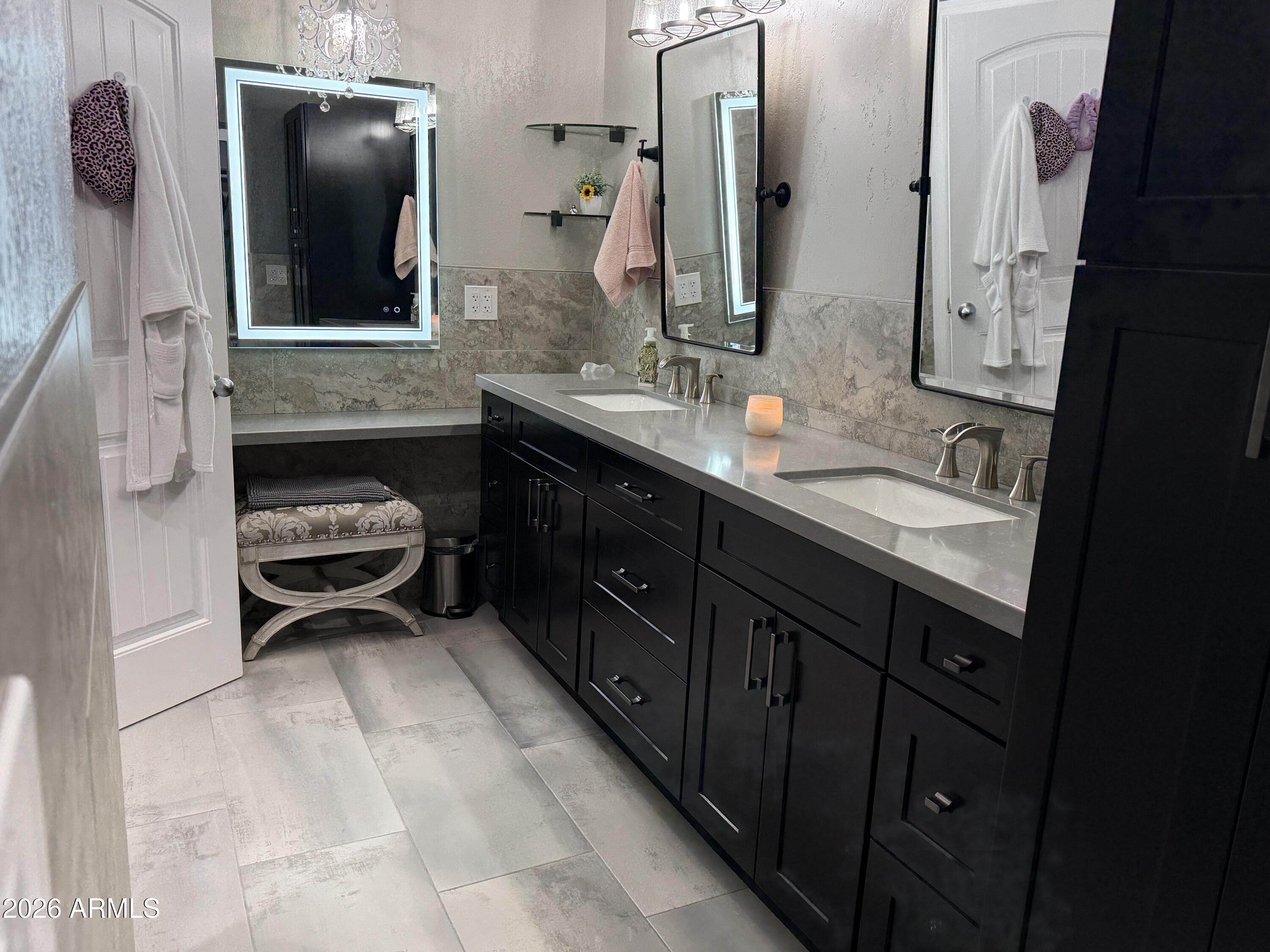 7732 West Wagoner Road Glendale, AZ 85308 - Photo 35 of 41 a spacious bathroom with a double vanity sink and mirror