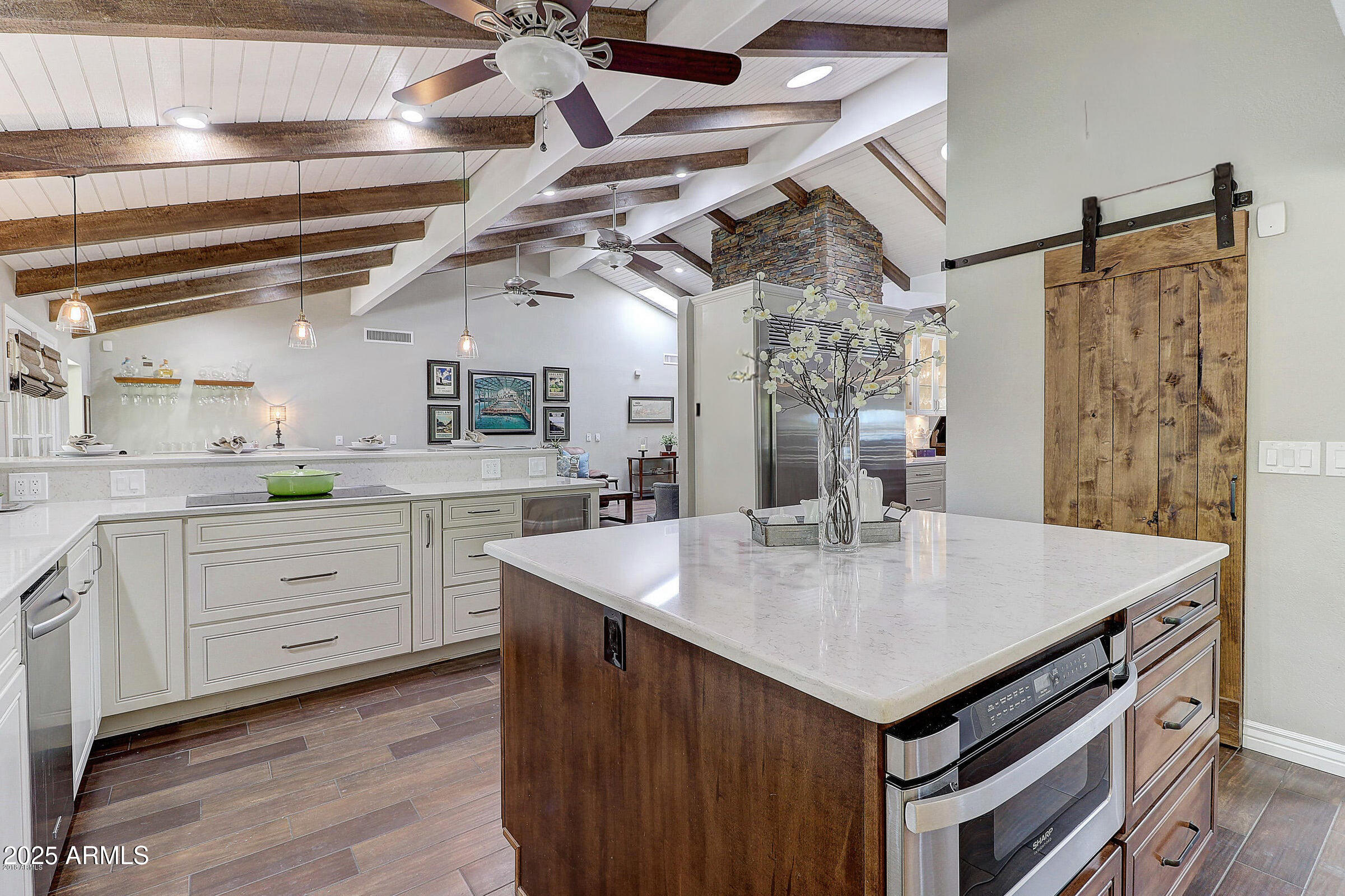7732 West Wagoner Road Glendale, AZ 85308 - Photo 6 of 41 a kitchen with a stove a sink and a refrigerator