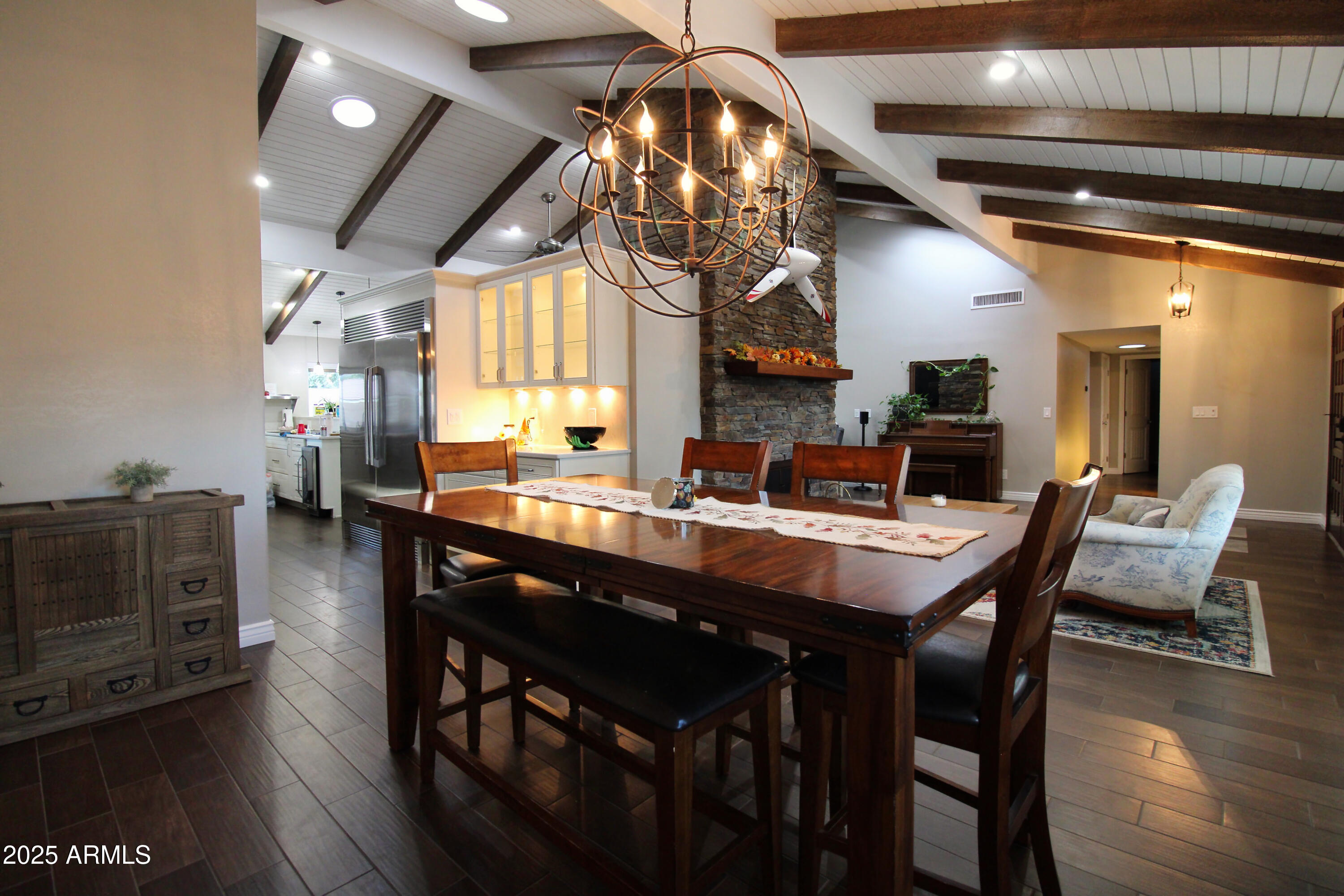 7732 West Wagoner Road Glendale, AZ 85308 - Photo 6 of 30 a dining table with chairs and wooden floor