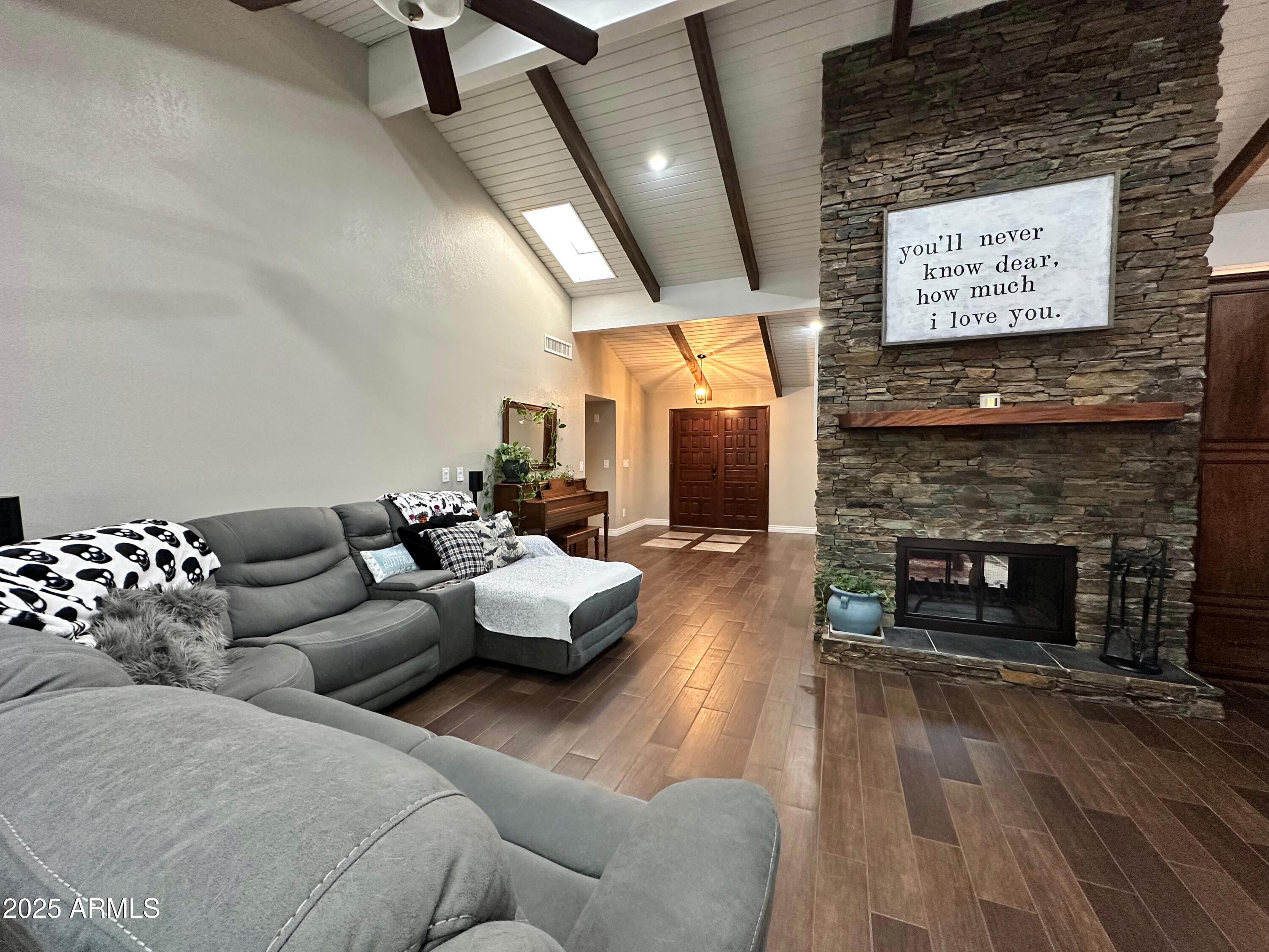 7732 West Wagoner Road Glendale, AZ 85308 - Photo 9 of 41 a living room with furniture and a fireplace