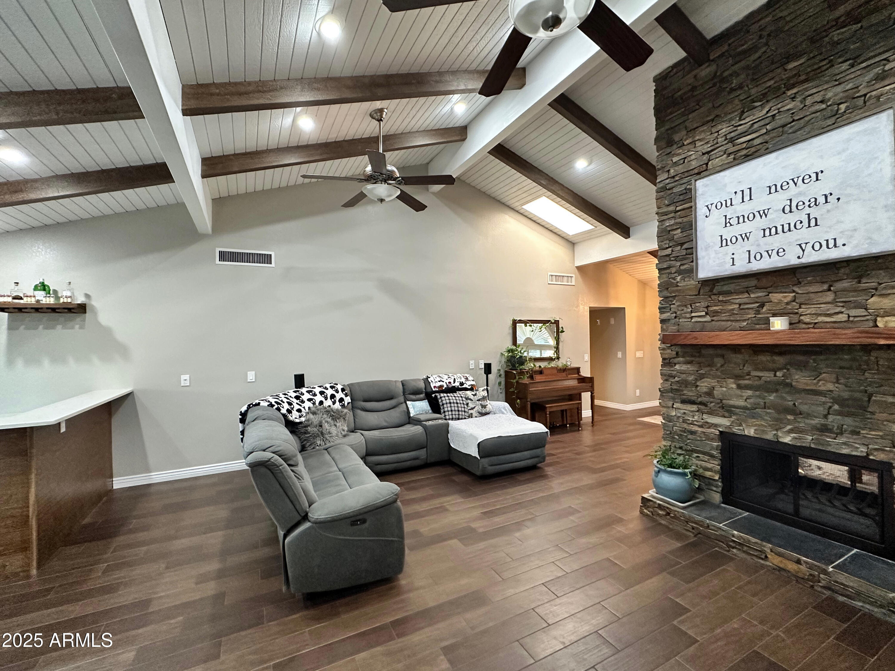 7732 West Wagoner Road Glendale, AZ 85308 - Photo 9 of 30 a living room with furniture and a fireplace