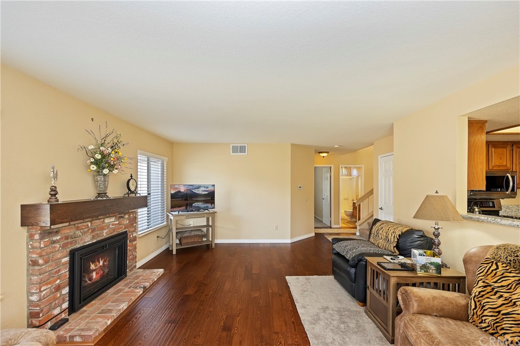 3534 Broken Feather Drive Norco, CA 92860 - Photo 12 of 33 a living room with furniture and a fireplace