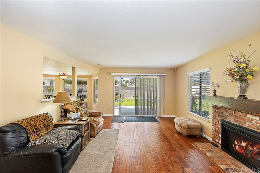 3534 Broken Feather Drive Norco, CA 92860 - Photo 13 of 33 a living room with furniture and a fireplace