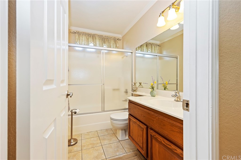 3534 Broken Feather Drive Norco, CA 92860 - Photo 14 of 33 a bathroom with a sink a toilet and shower