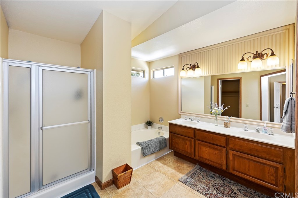 3534 Broken Feather Drive Norco, CA 92860 - Photo 20 of 33 a spacious bathroom with a double vanity sink and a mirror