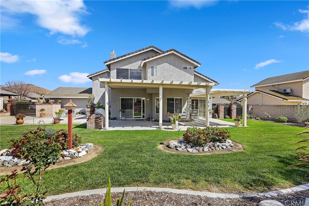 3534 Broken Feather Drive Norco, CA 92860 - Photo 32 of 33 a front view of a house with a yard table and chairs
