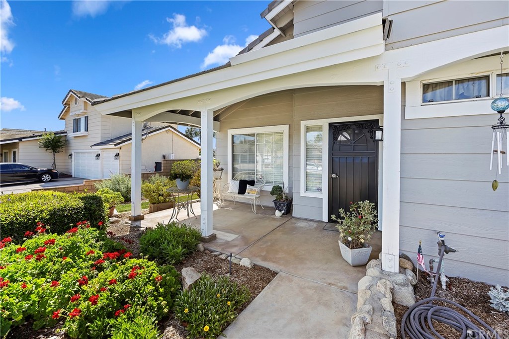 3534 Broken Feather Drive Norco, CA 92860 - Photo 4 of 33 a view of a house with chair and potted plants