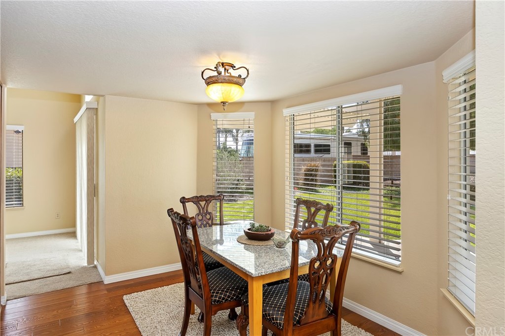 3534 Broken Feather Drive Norco, CA 92860 - Photo 9 of 33 a view of a dining room with furniture and wooden floor