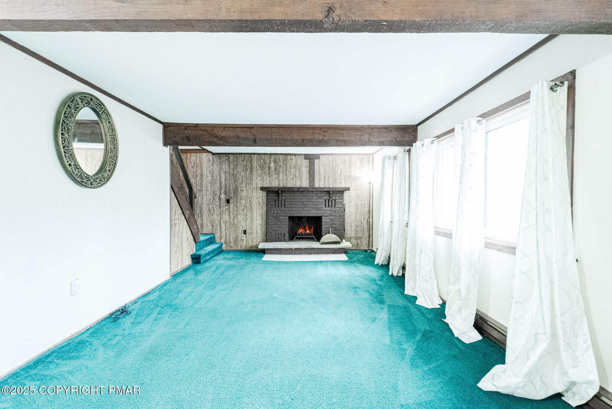6147 Decker Road Bushkill, PA 18324 - Photo 15 of 49 a view of a livingroom with wooden floor and a fireplace