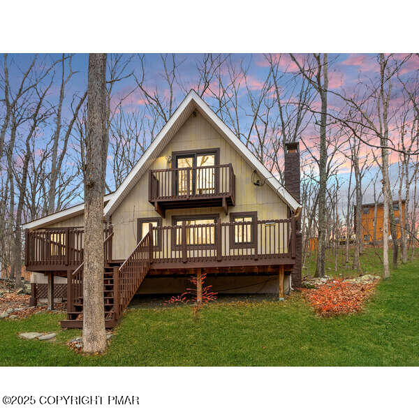 6147 Decker Road Bushkill, PA 18324 - Photo 2 of 49 a backyard of a house with wooden floor and a large tree