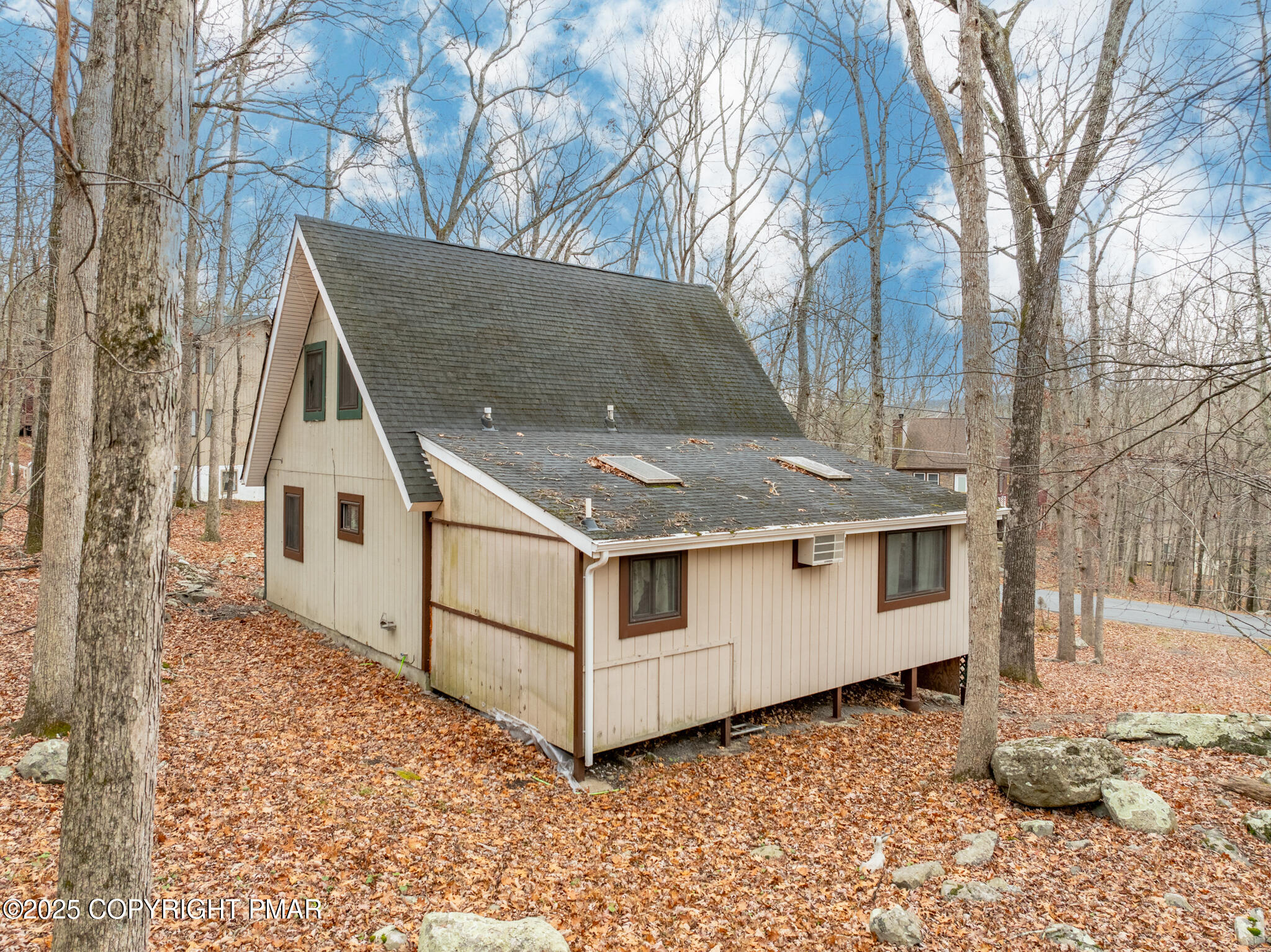 6147 Decker Road Bushkill, PA 18324 - Photo 36 of 49 a white house with a large tree in front of it