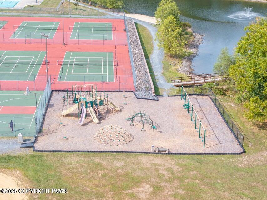 6147 Decker Road Bushkill, PA 18324 - Photo 47 of 49 a view of swimming pool with a dining table and chair