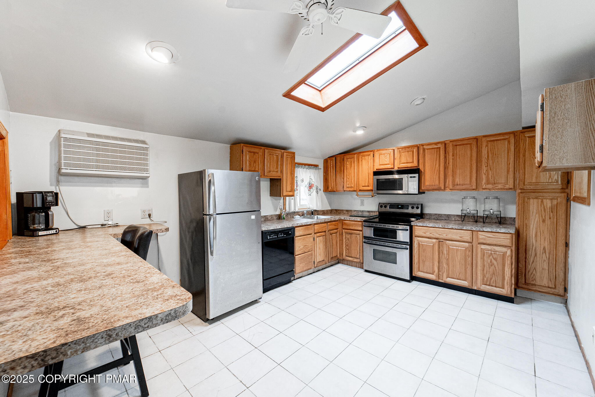 6147 Decker Road Bushkill, PA 18324 - Photo 5 of 49 a kitchen with granite countertop a refrigerator stove top oven and sink