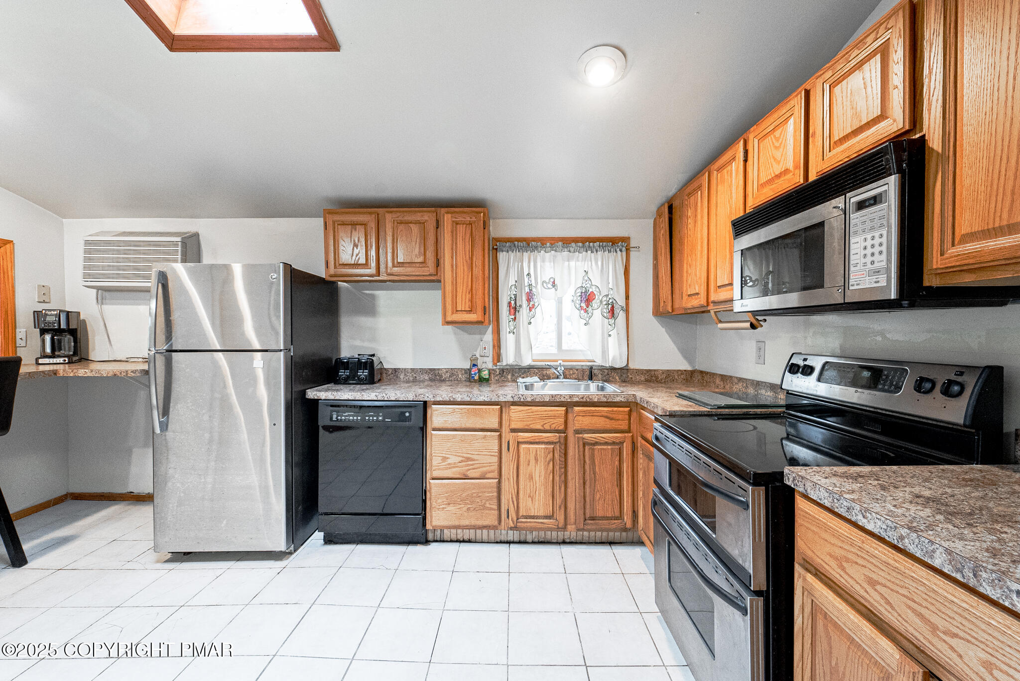6147 Decker Road Bushkill, PA 18324 - Photo 6 of 49 a kitchen with stainless steel appliances granite countertop a refrigerator sink and stove