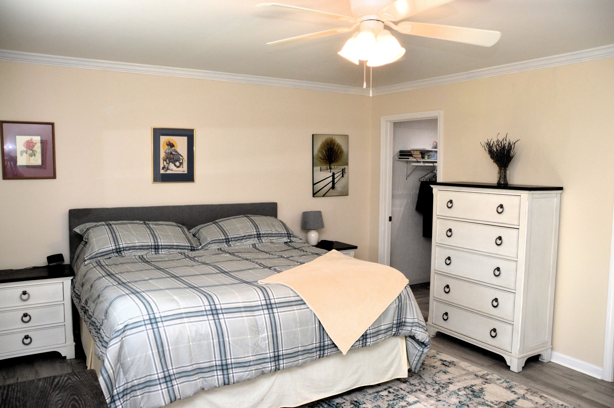 351 Hurricane Creek Road Linden, TN 37096 - Photo 26 of 41 a spacious bedroom with a bed and a chandelier