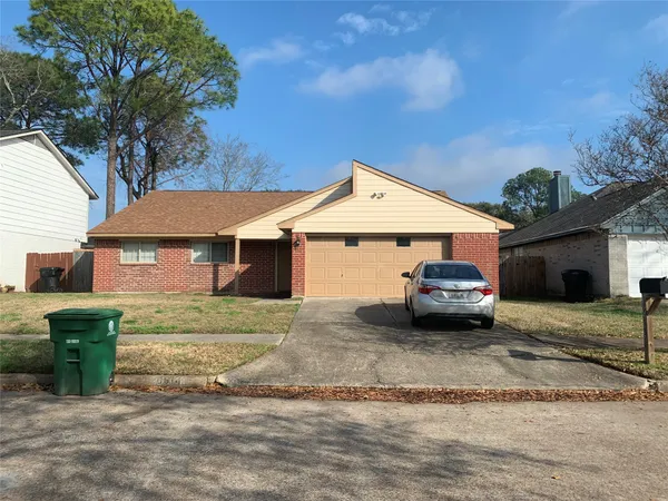 a view of a house with a yard and roof