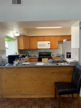 a kitchen with a table and chairs in it