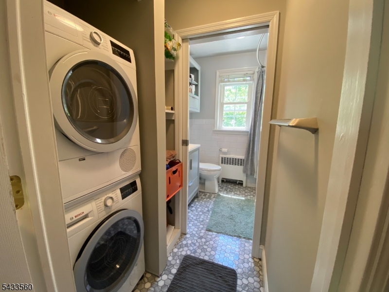 390 Morris Avenue, Unit 4 Summit, NJ 07901 - Photo 6 of 11 a view of a hallway with washer and dryer