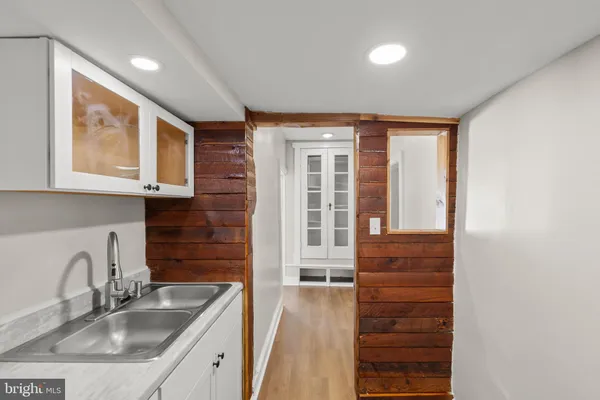 a kitchen with a sink cabinets and window