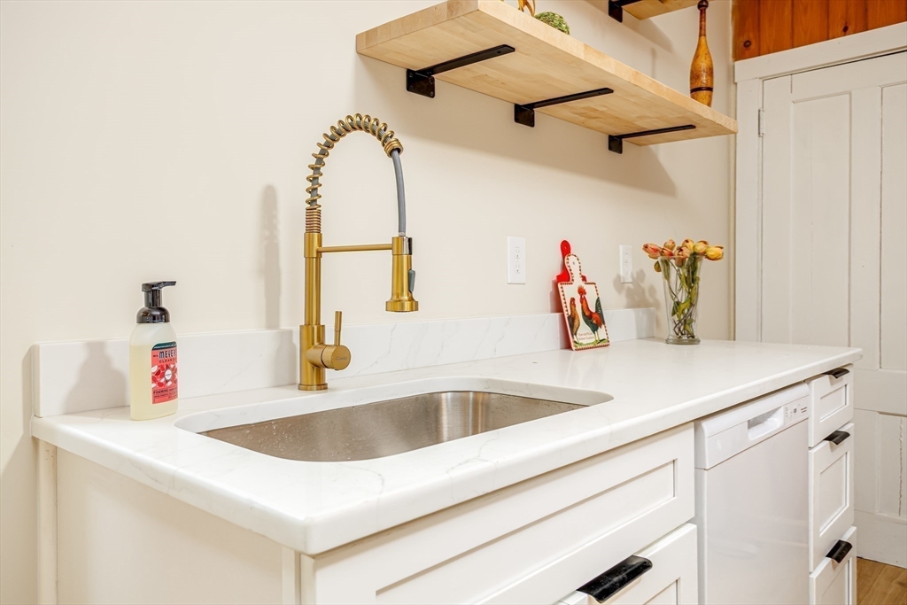 169 Spruce Street Winchendon, MA 01475 - Photo 4 of 32 a kitchen with a sink and a refrigerator