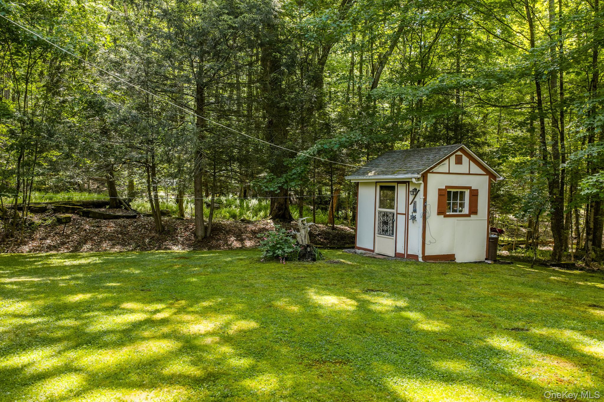 370 Starlight Road Monticello, NY 12701 - Photo 42 of 49 a house with a tree in front of it