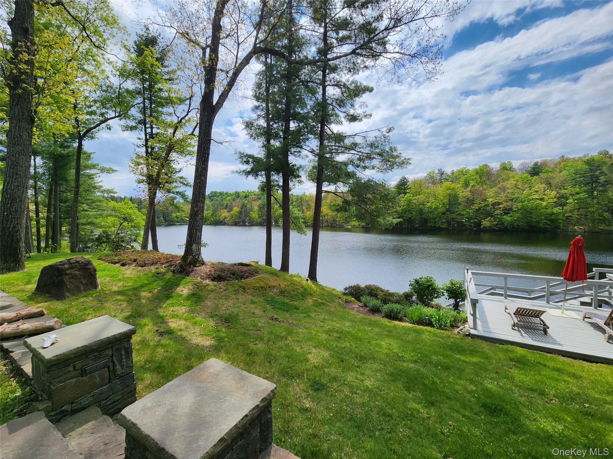 53 Lake Pleasant Road Staatsburg, NY 12580 - Photo 4 of 34 a backyard of a house with seating space
