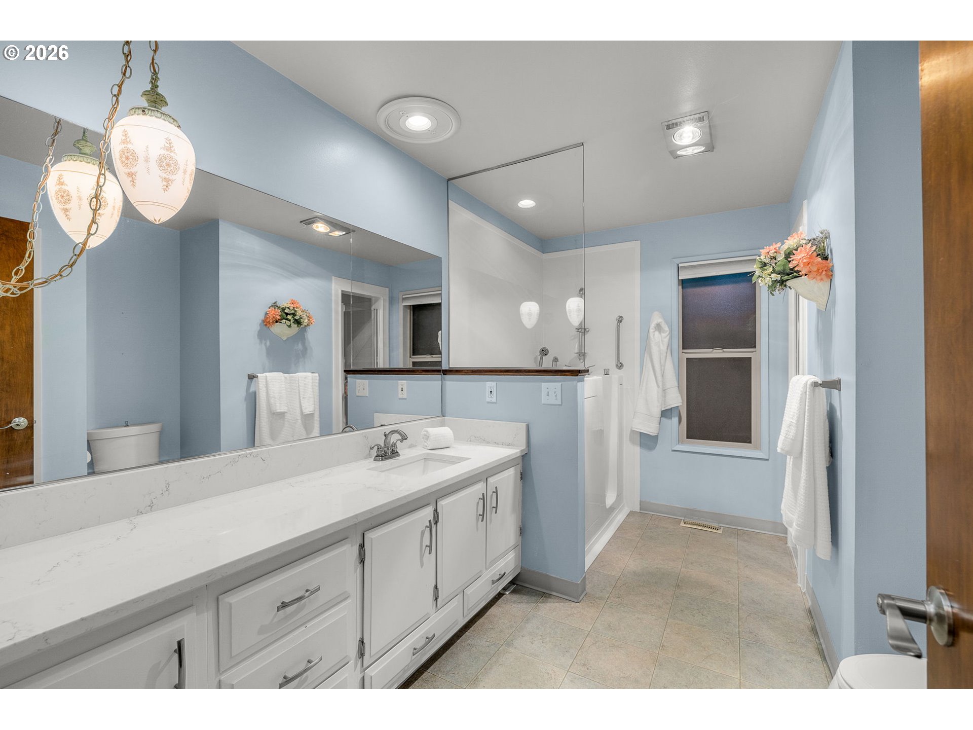 16020 Southeast Monner Road Happy Valley, OR 97086 - Photo 19 of 38 a bathroom with a sink a mirror and a shower