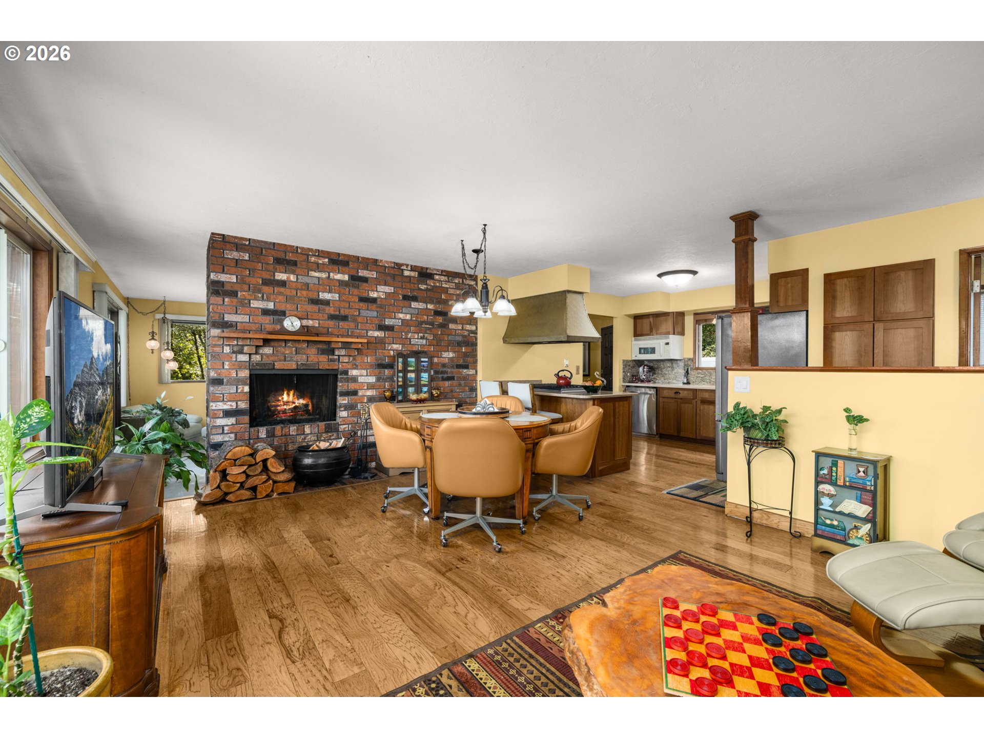 16020 Southeast Monner Road Happy Valley, OR 97086 - Photo 10 of 38 a living room with furniture a rug and kitchen view