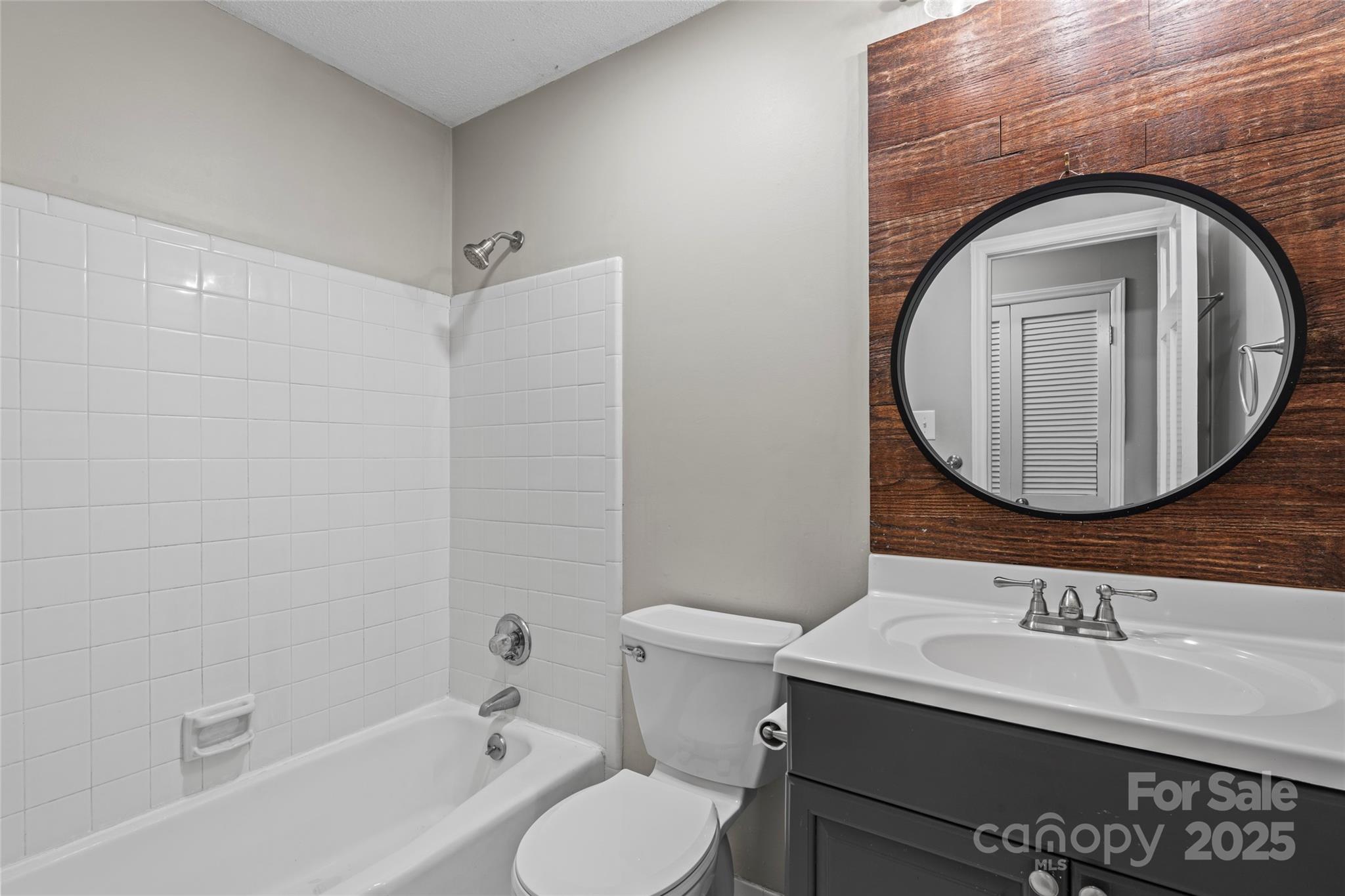 3616 Spokeshave Lane Matthews, NC 28105 - Photo 32 of 45 a bathroom with a sink and a mirror