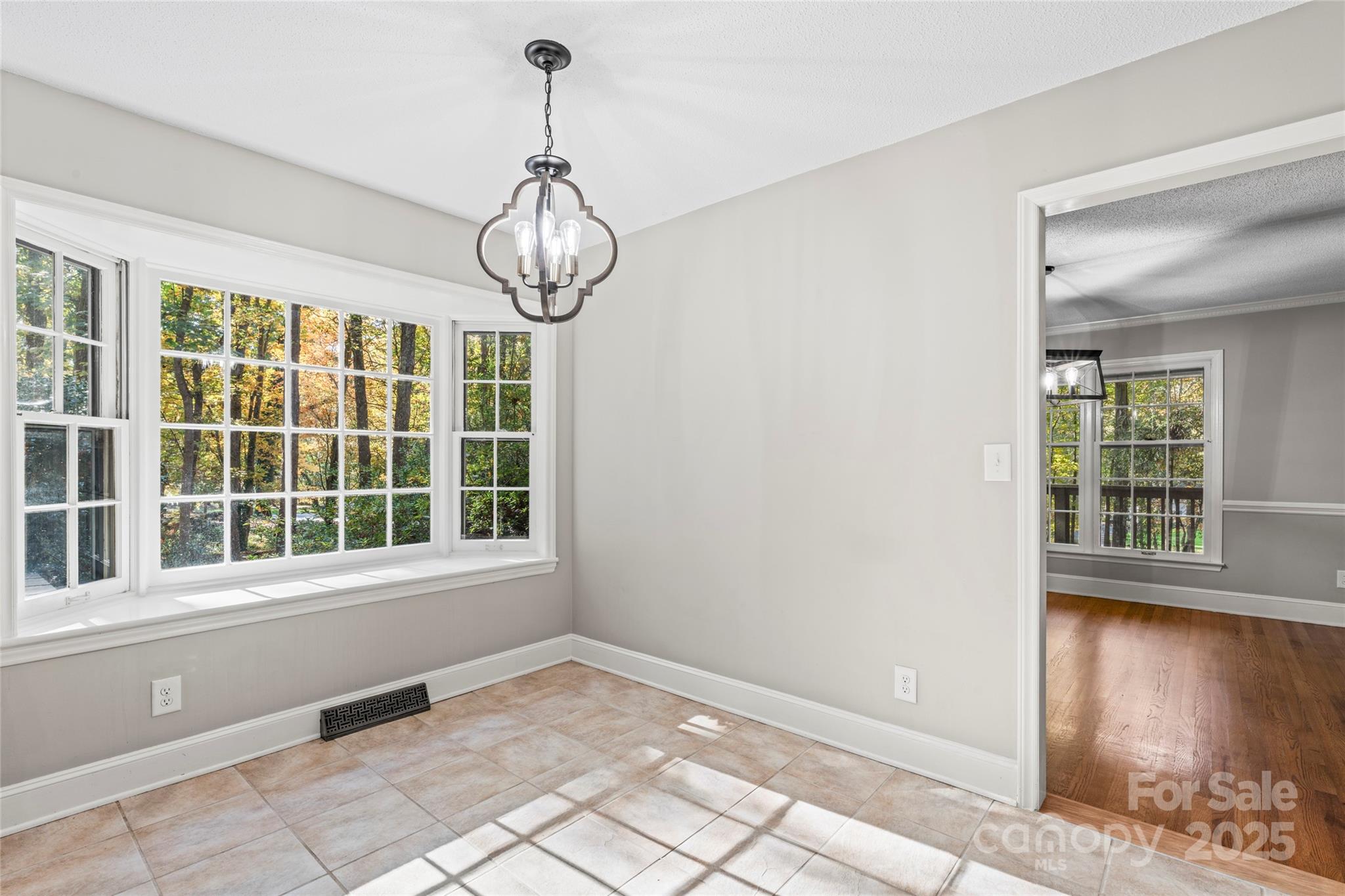 3616 Spokeshave Lane Matthews, NC 28105 - Photo 35 of 45 a view of an empty room with wooden floor and a window