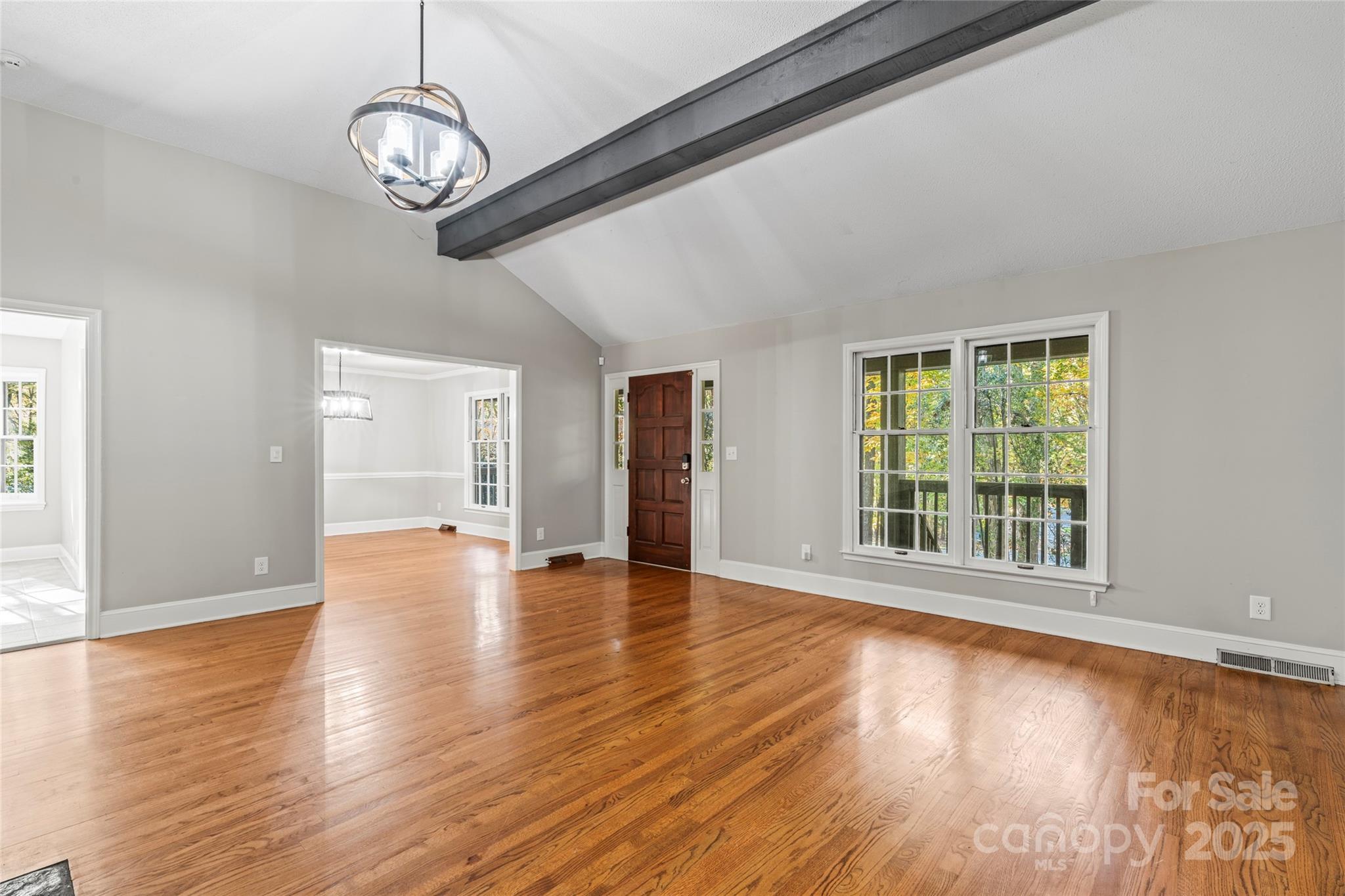 3616 Spokeshave Lane Matthews, NC 28105 - Photo 10 of 45 a view of empty room with wooden floor and window
