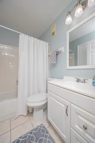 a view of balcony with wooden floor and flower pot
