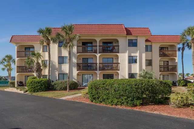 a kitchen with stainless steel appliances granite countertop a refrigerator sink and stove