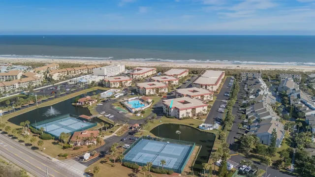 a kitchen with stainless steel appliances granite countertop a refrigerator a sink and a stove