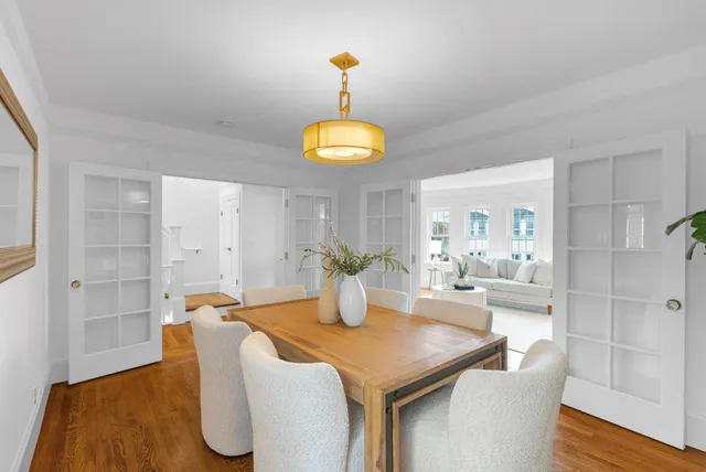 a dining room with table and chairs