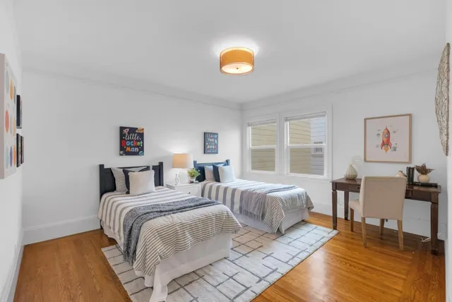 a bedroom with a bed and a table