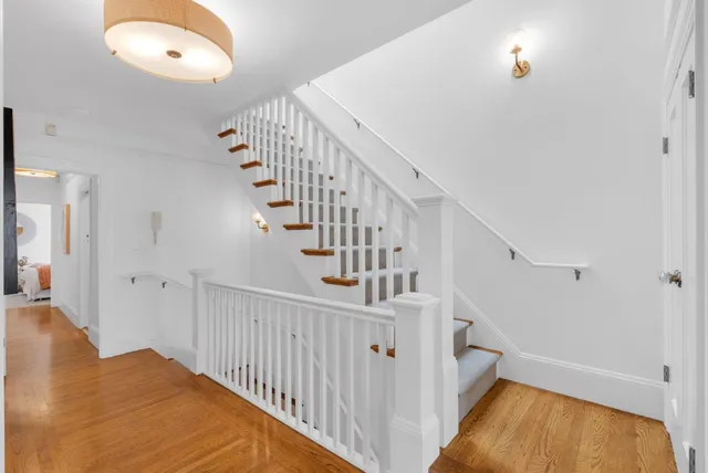 a view of staircase with white walls