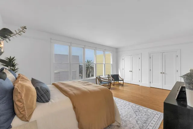 a bed room with a bed and a couch