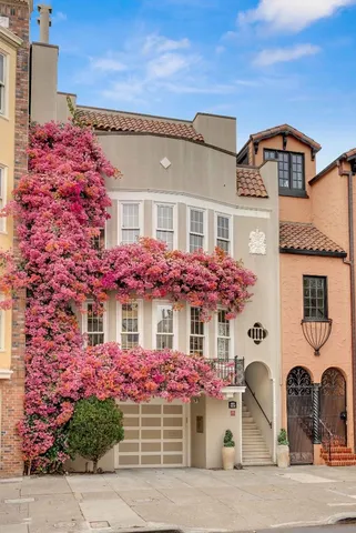front view of a house with a flowers