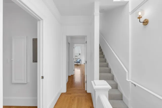 a view of entryway with wooden floor and staircase