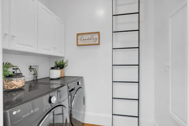 a table with cabinets and wooden floor