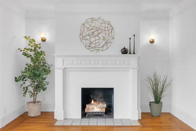a view of a livingroom with furniture and a fireplace