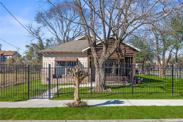 a view of a house next to a yard