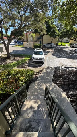 a view of a backyard with table and chairs