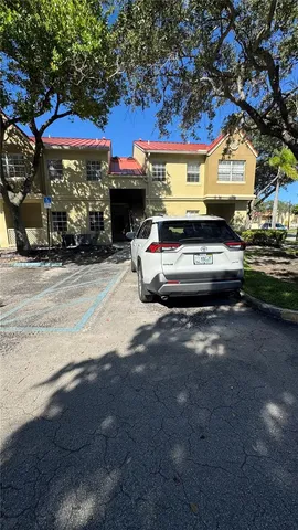 a view of balcony with wooden floor