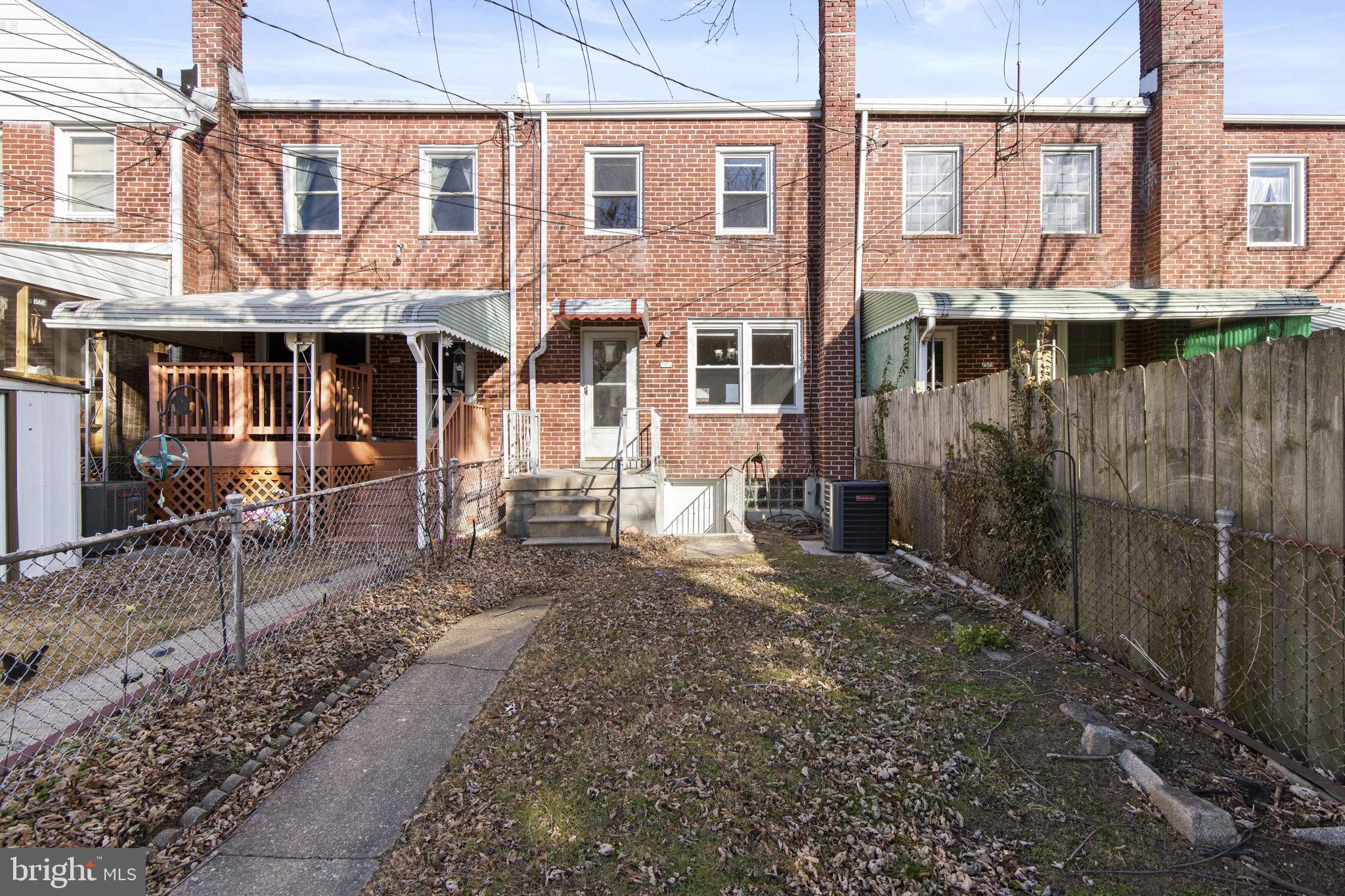 7571 Westfield Road Dundalk, MD 21222 - Photo 15 of 21 a view of a brick house with large windows