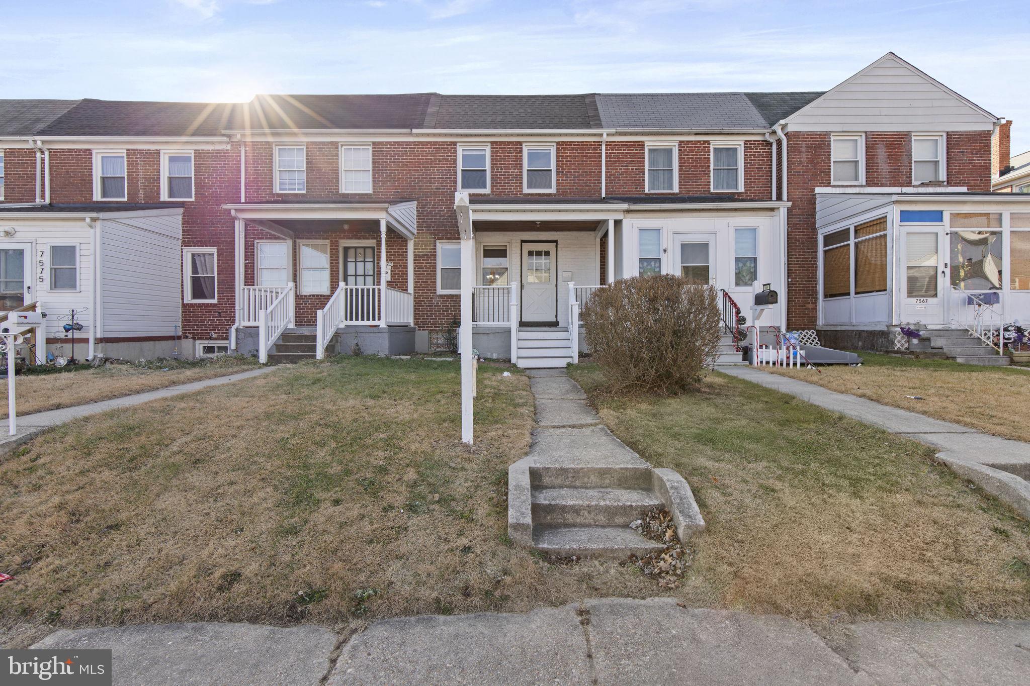 7571 Westfield Road Dundalk, MD 21222 - Photo 17 of 21 a front view of a house with a yard