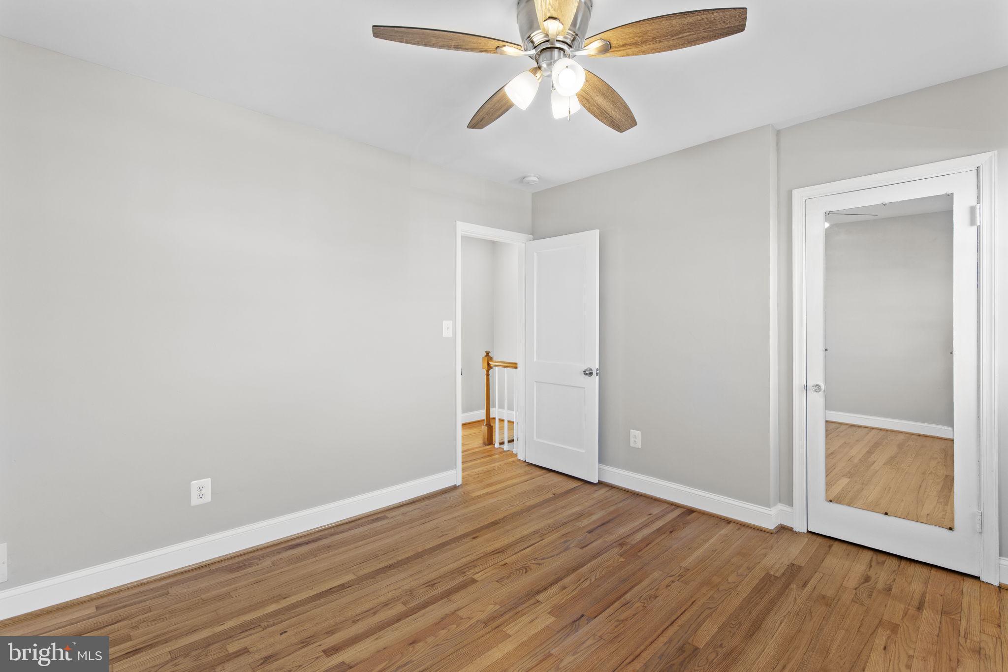 7571 Westfield Road Dundalk, MD 21222 - Photo 10 of 21 a view of an empty room with wooden floor