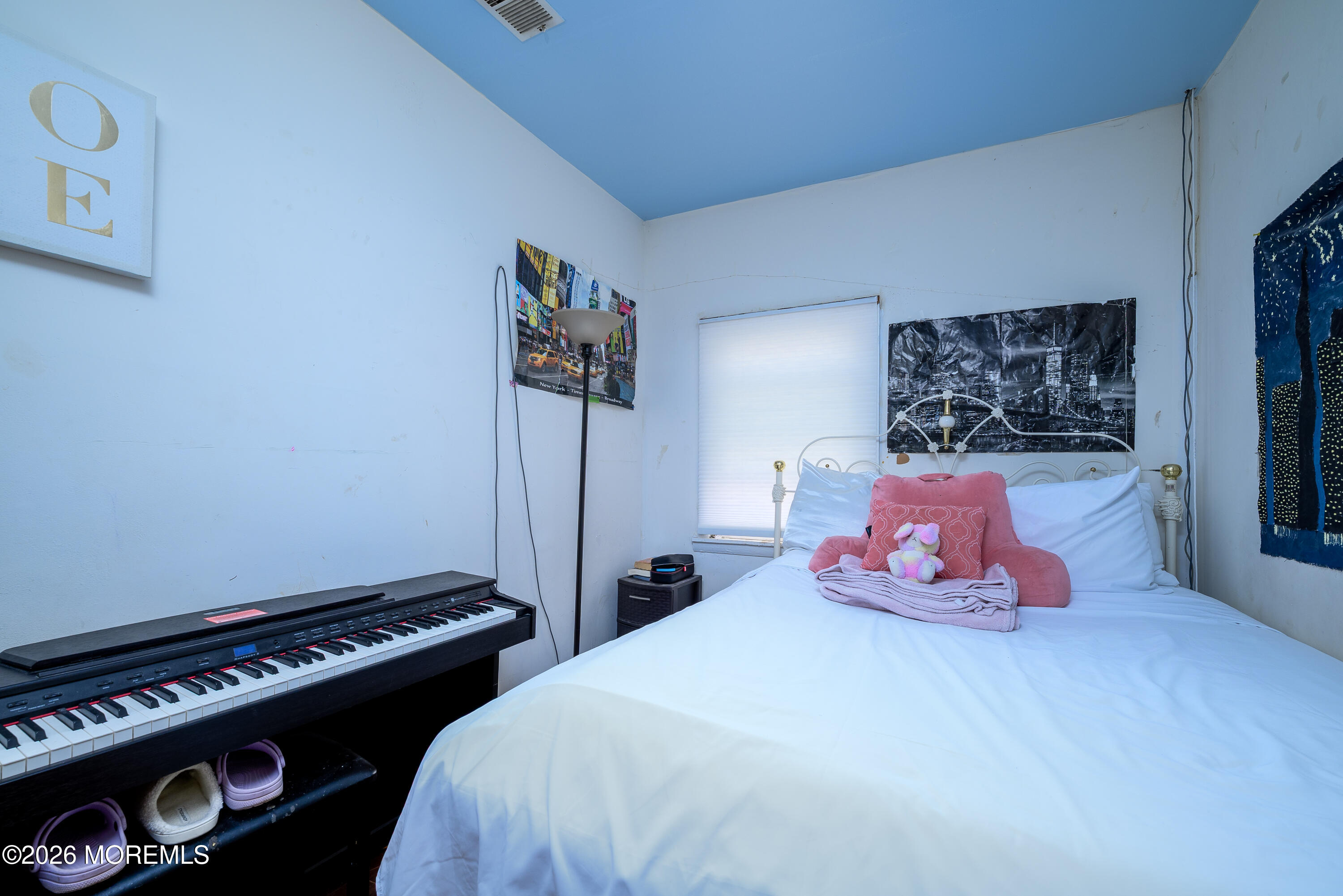 2nd Avenue, Unit 2 Long Branch, NJ 07740 - Photo 10 of 32 a bedroom with a bed and painting on the wall