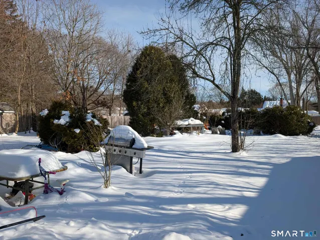 a kitchen with refrigerator a microwave and cabinets